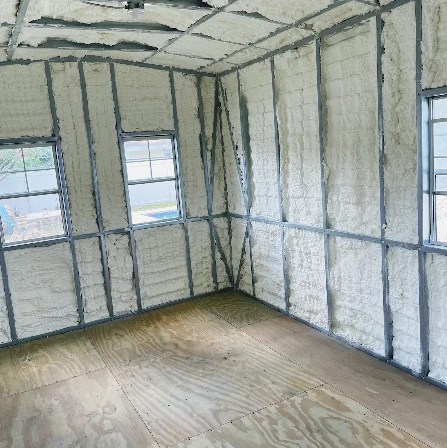 Closed-cell spray foam insulation applied to wall cavities in a residential project in Windham